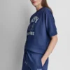 Jersey con logo DKNY 1989 con tachuelas