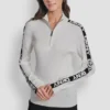 Jerséis de manga larga con cremallera de 1/4 y cinta con el logotipo Jerséis de manga larga con cremallera de 1/4 y cinta con el logotipo
