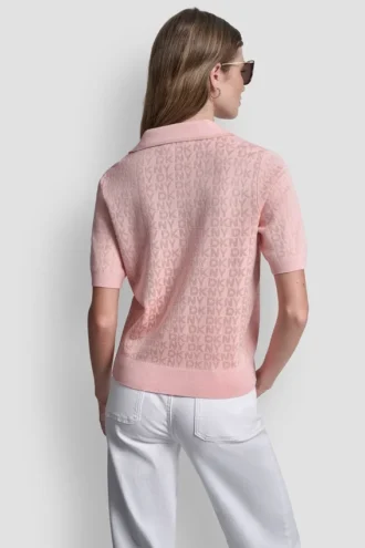 Jerséu con cuello polo y logotipo de pedrería