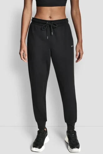 Pantalones Jogger con logo de pedrería y puños