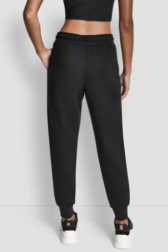 Pantalones Jogger con logo de pedrería y puños