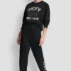 Pantalones Jogger con logo DKNY 1989 con tachuelas de strass
