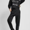 Pantalones Jogger con logo DKNY 1989 con tachuelas de strass